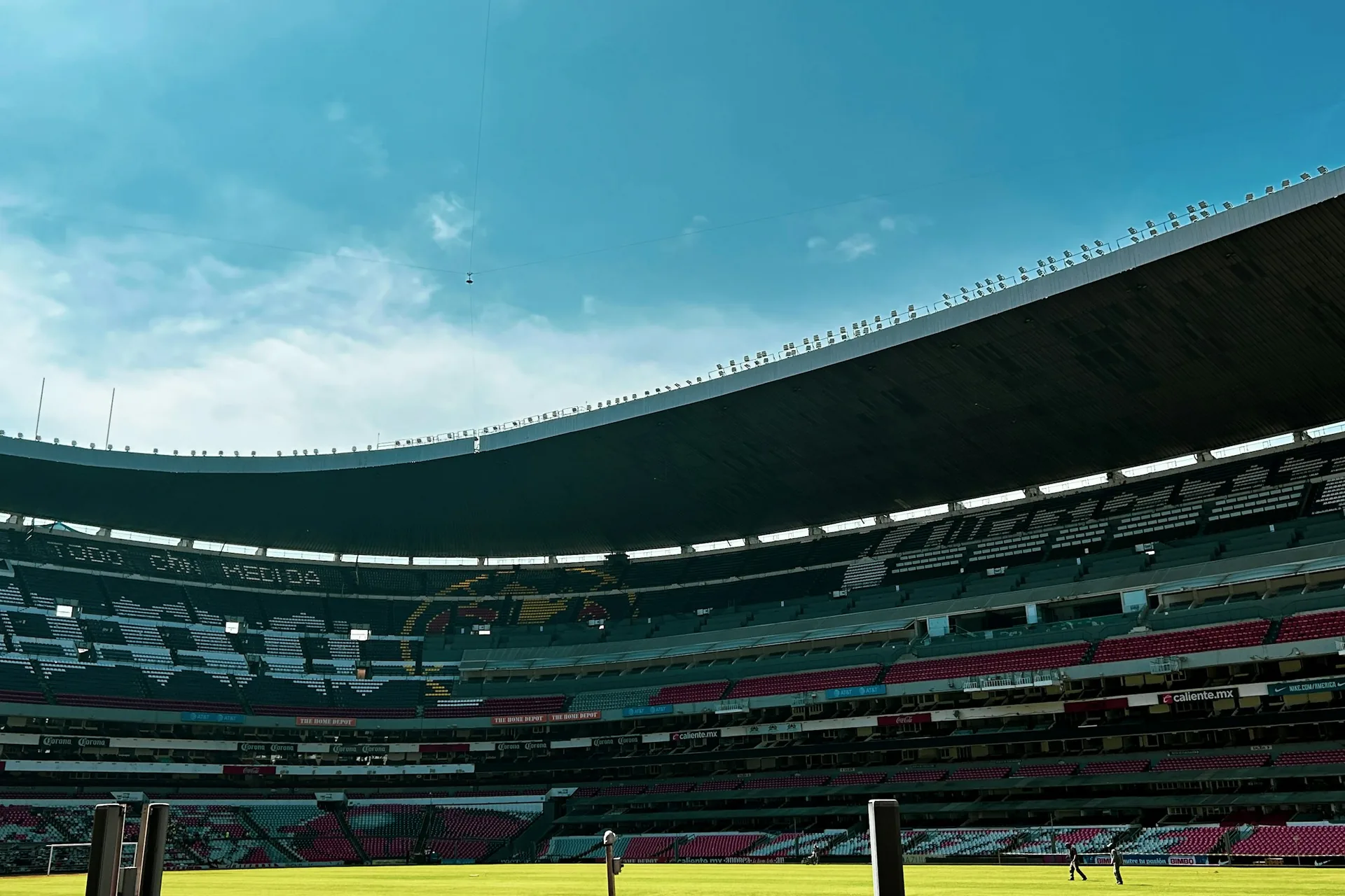 Interior of Estadio Azteca in Mexico City, a host venue for the 2026 FIFA World Cup, beneath a blue sky