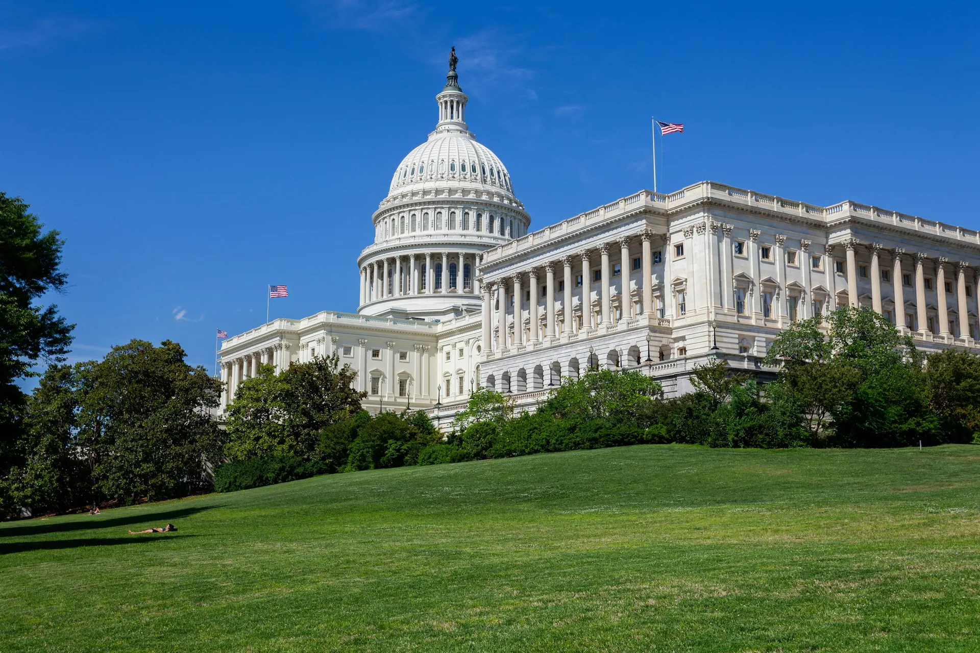 United States Capitol building in Washington DC under a clear blue sky